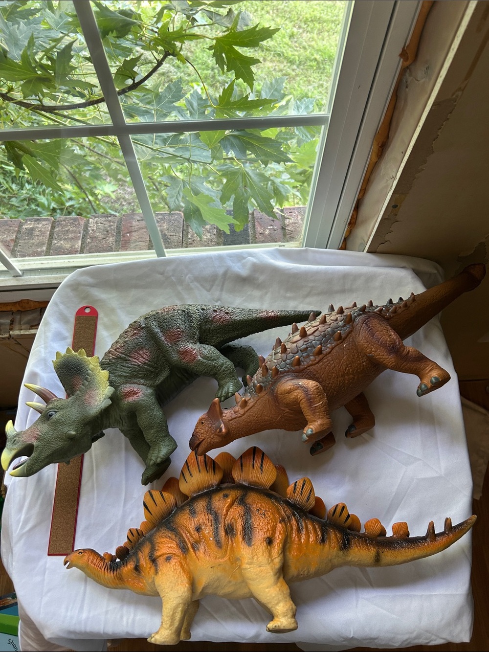 3 very large toy dinosaurs